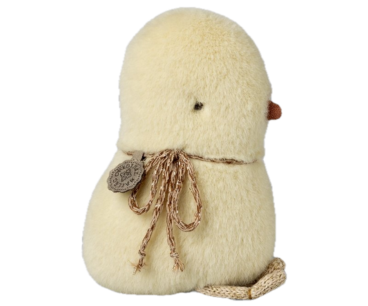 Small plush bird with a string bow on a white background