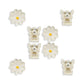 Set of white hair clips with floral designs on a white background